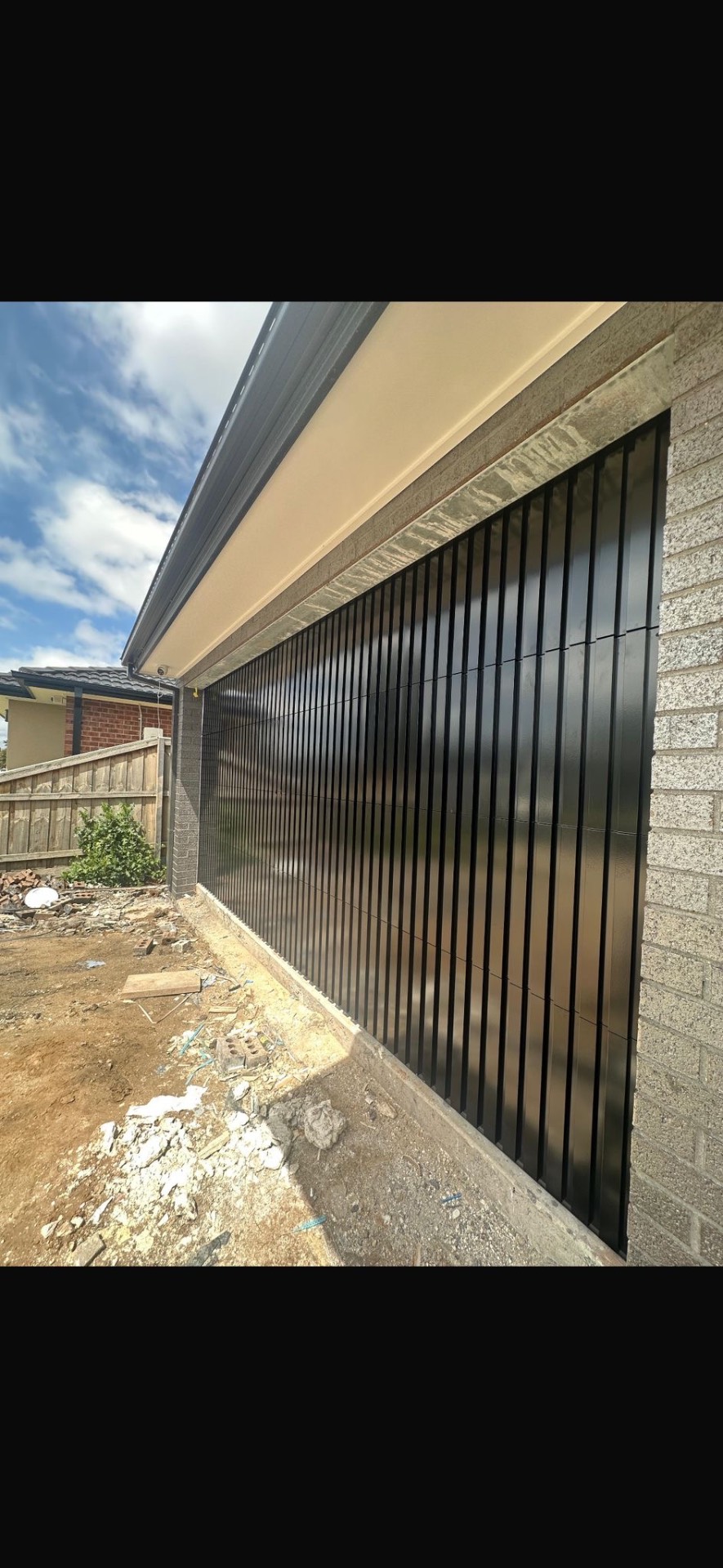 Custom Cladded Panel garage door install 10