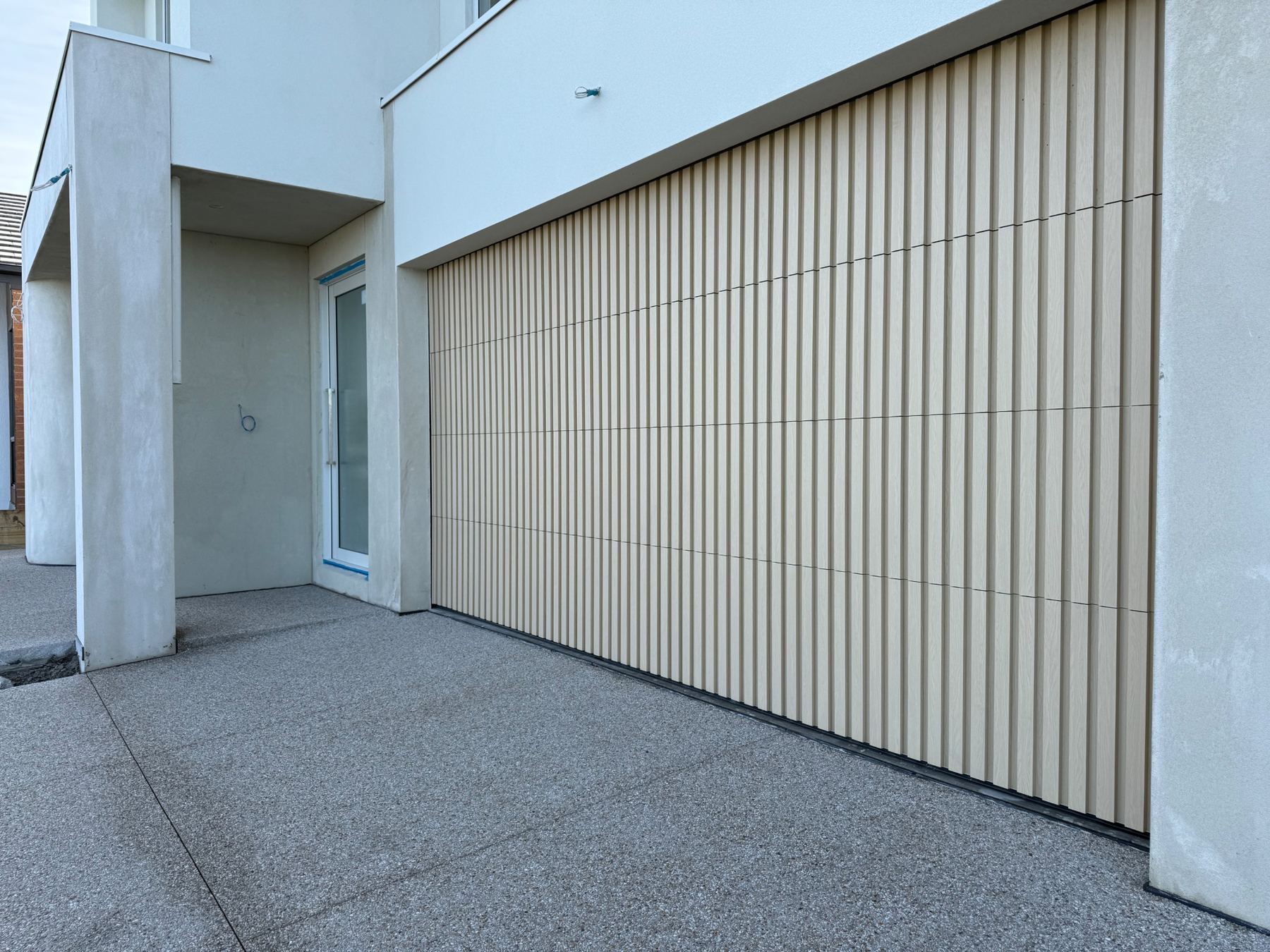 Custom Cladded Panel garage door install 5